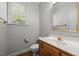 Bathroom featuring a vanity, toilet, and mirror at 100 Silver Lining Ln, Cary, NC 27513