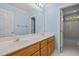 Bright bathroom boasts double sinks, wood cabinets, and a large framed mirror at 100 Silver Lining Ln, Cary, NC 27513
