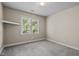 Bedroom offers natural lighting from window and shelf at 100 Silver Lining Ln, Cary, NC 27513