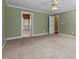 A spacious bedroom with plush carpeting, ensuite bathroom, walk in closet, and plenty of natural light at 100 Silver Lining Ln, Cary, NC 27513