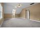 Large bonus room with a fan, carpet, and adjacent door at 100 Silver Lining Ln, Cary, NC 27513