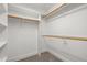 Walk-in closet providing ample storage space with multiple shelves and hanging rods to keep everything organized at 100 Silver Lining Ln, Cary, NC 27513