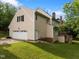 Back of home featuring attached garage, back yard, and wooden deck at 100 Silver Lining Ln, Cary, NC 27513