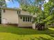 Back of home featuring a wooden deck and large backyard at 100 Silver Lining Ln, Cary, NC 27513