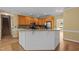 Kitchen with wood cabinets, granite countertops, stainless steel appliances, and island at 100 Silver Lining Ln, Cary, NC 27513