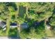 Aerial view of a home with a large, tree-filled lot in a serene, wooded neighborhood setting at 1012 Bermuda Run, Knightdale, NC 27545