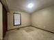 This bedroom features neutral walls, a window, blinds, and a closet at 1012 Bermuda Run, Knightdale, NC 27545