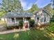 Charming single-story home with a welcoming front porch and well-maintained yard with mature shade trees at 1012 Bermuda Run, Knightdale, NC 27545