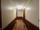 Inviting hallway with wood trim and durable wood flooring leading to various rooms at 1012 Bermuda Run, Knightdale, NC 27545