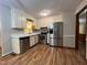 Functional kitchen with stainless steel appliances and ample cabinet space, ready for cooking at 1012 Bermuda Run, Knightdale, NC 27545