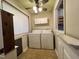 Convenient laundry room with washer, dryer, and storage, maximizing functionality at 1012 Bermuda Run, Knightdale, NC 27545