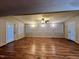 Bright and airy living room boasting lots of windows and natural light, complete with wood floors at 1012 Bermuda Run, Knightdale, NC 27545
