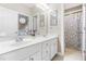 Bright bathroom featuring double sinks, a separate toilet room and walk-in shower at 104 Edgewater Cir, Chapel Hill, NC 27516