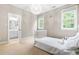 Comfortable bedroom space with a glimpse into attached bathroom at 104 Edgewater Cir, Chapel Hill, NC 27516
