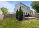 View of the home's backyard with a patio and lush landscaping at 109 Gladstone Dr, Durham, NC 27703