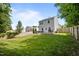 Spacious backyard with a well-maintained lawn, patio, and a wooden fence at 109 Gladstone Dr, Durham, NC 27703