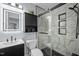 Contemporary bathroom featuring illuminated mirror, decorative vanity, and glass-enclosed tiled shower at 109 Gladstone Dr, Durham, NC 27703