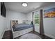 Cozy bedroom featuring a built-in bed, ample natural light, and stylish decor for a comfortable retreat at 109 Gladstone Dr, Durham, NC 27703