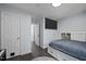 Comfortable bedroom featuring a mounted television and built-in storage beneath the bed for organization at 109 Gladstone Dr, Durham, NC 27703