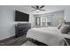 Large bedroom featuring a ceiling fan, a large window, and hardwood floors at 109 Gladstone Dr, Durham, NC 27703