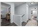 Hallway featuring hardwood floors and white trim at 109 Gladstone Dr, Durham, NC 27703