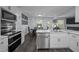 Modern kitchen with a marble countertop island and a dining area at 109 Gladstone Dr, Durham, NC 27703