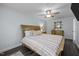 Relaxing main bedroom featuring neutral tones, a ceiling fan, and a stylish dresser for storage at 109 Gladstone Dr, Durham, NC 27703