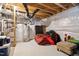 Unfinished basement with exposed ductwork, water heater, and concrete flooring at 119 Eagles Watch Ln, Chapel Hill, NC 27517