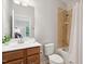 Bathroom with a single sink vanity, tiled shower-tub combination, and a toilet at 119 Eagles Watch Ln, Chapel Hill, NC 27517