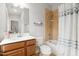 Standard bathroom with a single sink vanity, tiled shower-tub combination, and a toilet at 119 Eagles Watch Ln, Chapel Hill, NC 27517