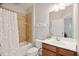 Neutral bathroom featuring a tub and shower combination and a decorative shower curtain at 119 Eagles Watch Ln, Chapel Hill, NC 27517