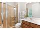 Bathroom features a glass shower and wood vanity with white sink at 119 Eagles Watch Ln, Chapel Hill, NC 27517