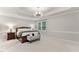 Spacious primary bedroom features a tray ceiling, neutral decor, and plenty of natural light at 119 Eagles Watch Ln, Chapel Hill, NC 27517