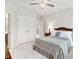 Bedroom with a bed, bedside table, lamps, and open doorway at 119 Eagles Watch Ln, Chapel Hill, NC 27517