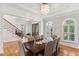 An elegant dining room features a chandelier and a dark wood table at 119 Eagles Watch Ln, Chapel Hill, NC 27517