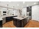 Spacious kitchen features a large center island, granite countertops, and stainless steel appliances at 119 Eagles Watch Ln, Chapel Hill, NC 27517