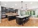 Modern kitchen features dark cabinetry, granite countertops, and stainless steel appliances at 119 Eagles Watch Ln, Chapel Hill, NC 27517