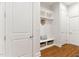 Well-organized mudroom with built-in storage, shelving, and coat hooks for convenient organization at 119 Eagles Watch Ln, Chapel Hill, NC 27517