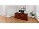 Home office with hardwood floors and a built-in desk at 119 Eagles Watch Ln, Chapel Hill, NC 27517