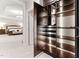 Custom walk-in closet features shelving and hanging space, with bedroom view in the background at 119 Eagles Watch Ln, Chapel Hill, NC 27517
