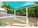 Back deck with outdoor lighting, a covering, and a backyard view at 121 River Hills Dr, Clayton, NC 27527