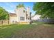 Spacious backyard featuring a trampoline, well-kept lawn, and a deck at 121 River Hills Dr, Clayton, NC 27527