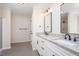 Bright bathroom featuring double vanities with granite countertops and modern fixtures at 121 River Hills Dr, Clayton, NC 27527