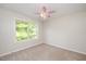Bright bedroom with a window and a ceiling fan at 121 River Hills Dr, Clayton, NC 27527