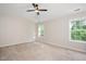 Large bedroom with carpet, large windows, and lots of natural light at 121 River Hills Dr, Clayton, NC 27527