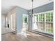 Bright dining area with large windows and modern chandelier at 121 River Hills Dr, Clayton, NC 27527