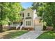 Charming two-story home with manicured lawn, attached garage and welcoming front porch at 121 River Hills Dr, Clayton, NC 27527