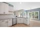 Modern kitchen featuring granite countertops, stainless steel appliances, and white cabinetry at 121 River Hills Dr, Clayton, NC 27527