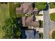 Aerial view of homes showcasing their roof lines, driveways, and lush green surroundings in a well-planned community at 121 Walter Hagen Dr, Mebane, NC 27302