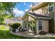 Beautiful backyard featuring a patio, comfortable seating, and mature trees at 121 Walter Hagen Dr, Mebane, NC 27302